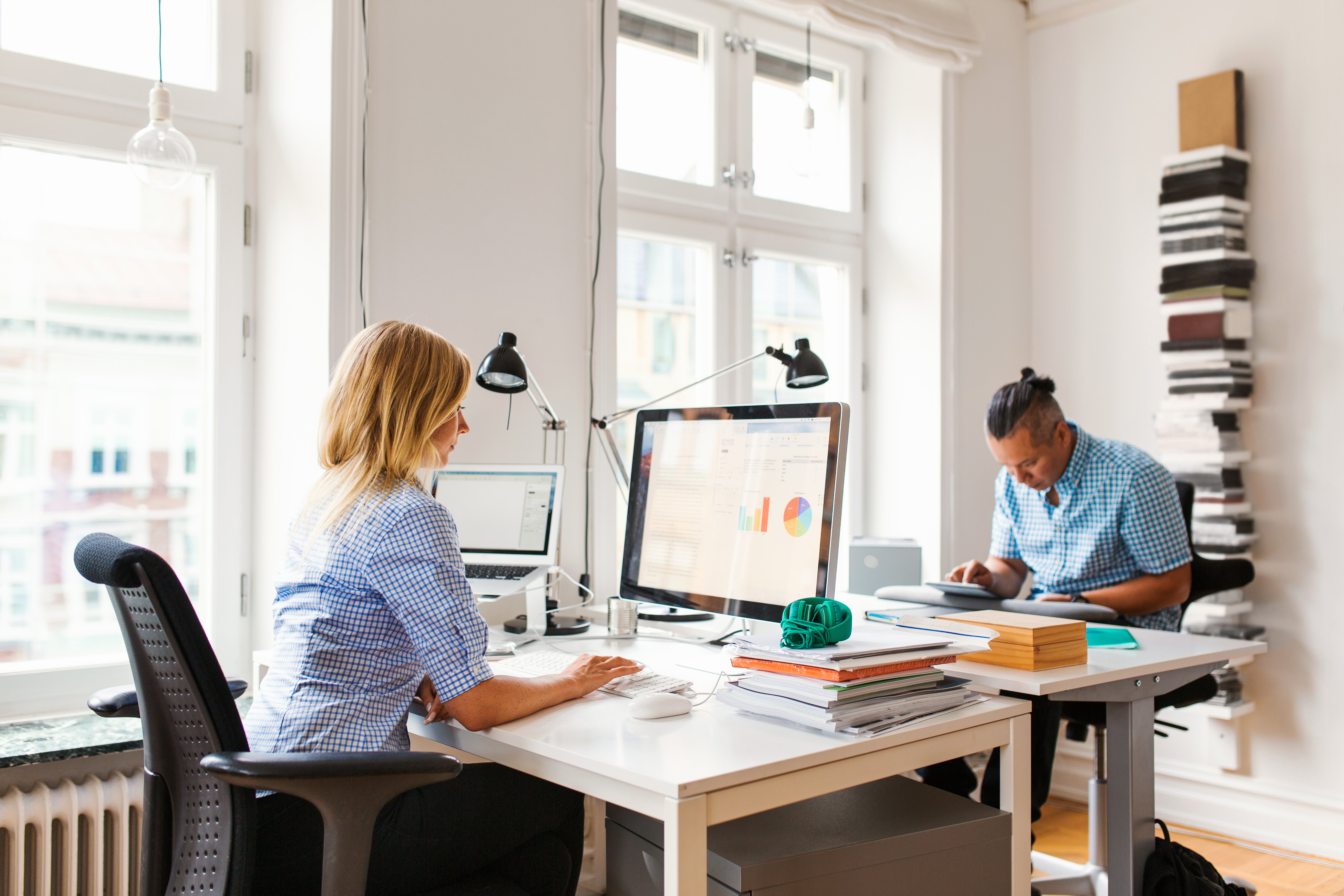 Working at computers in office