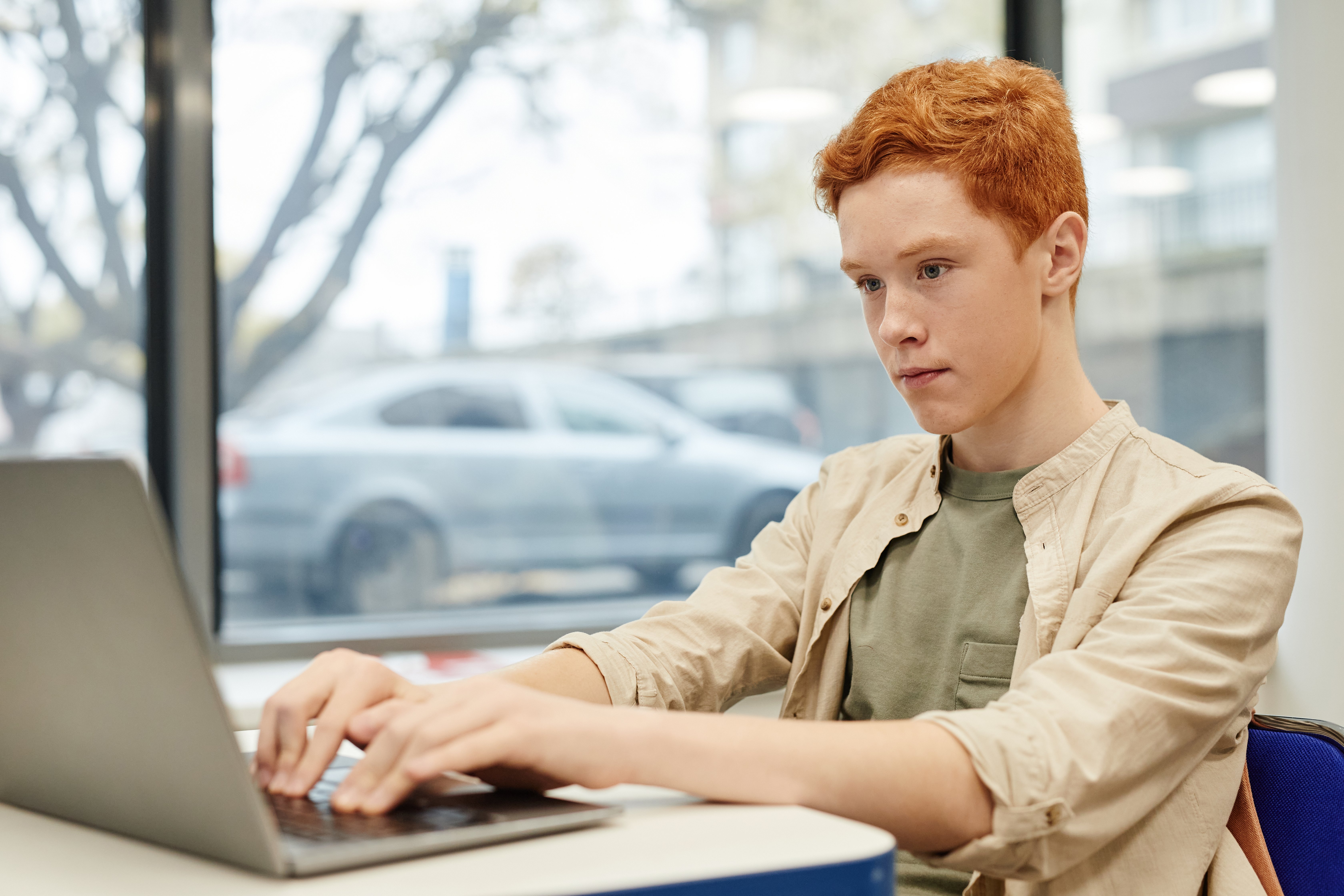 boy-using-laptop-in-school-2021-12-16-21-31-40-utc