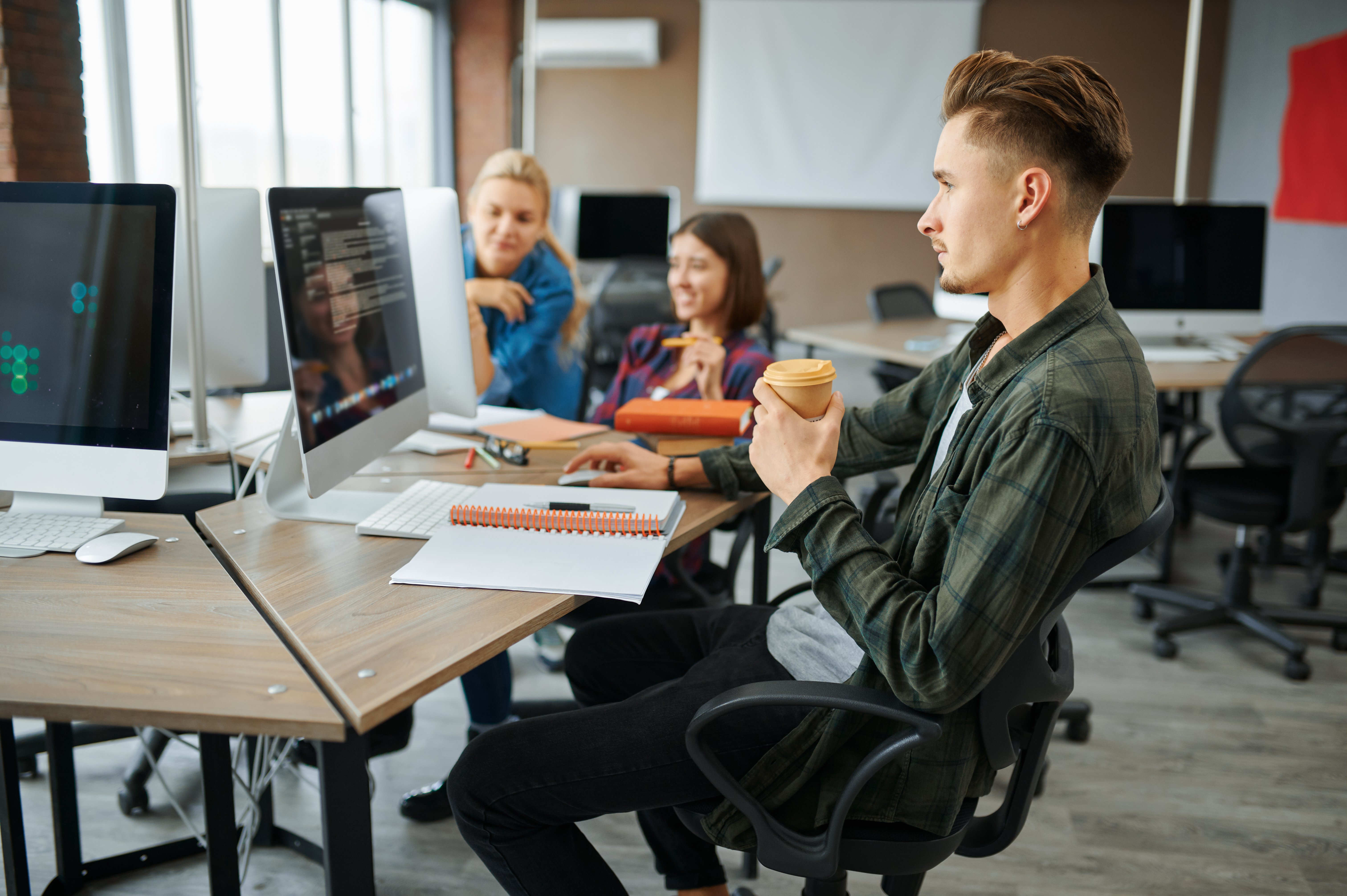 young-it-specialists-works-on-computers-in-office-2022-02-01-22-39-15-utc